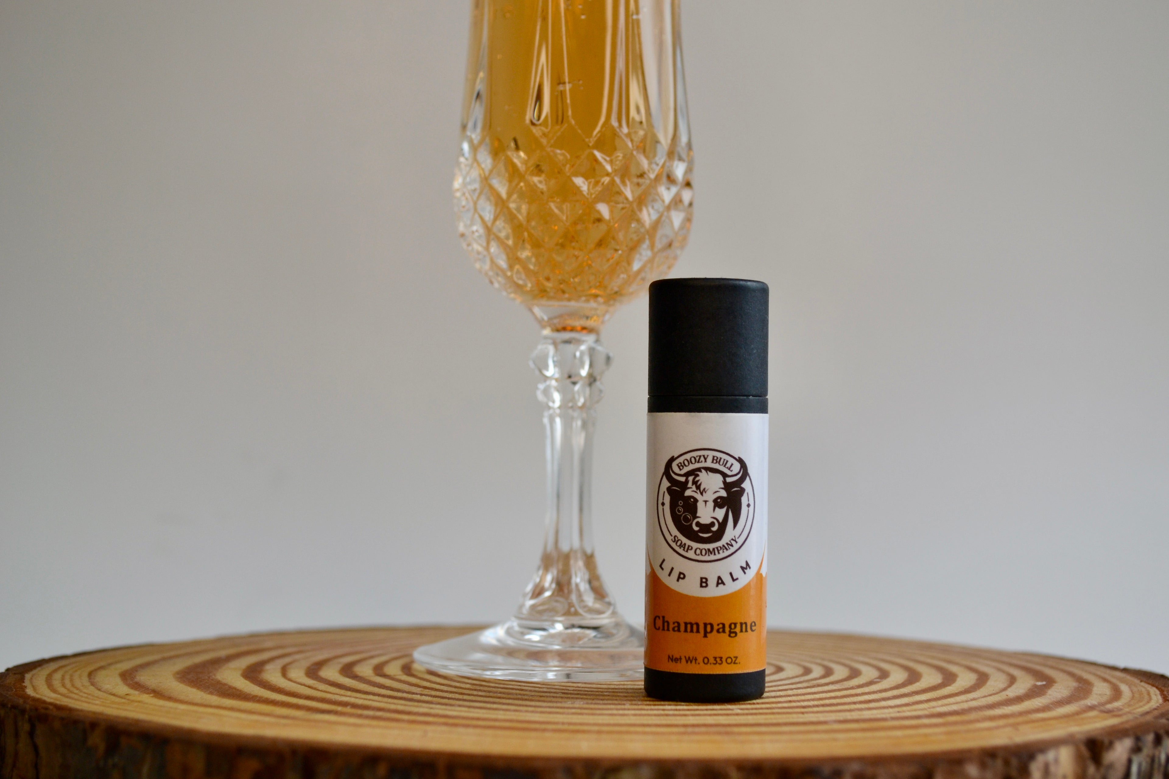 Bottle of champagne with a label on a wooden surface