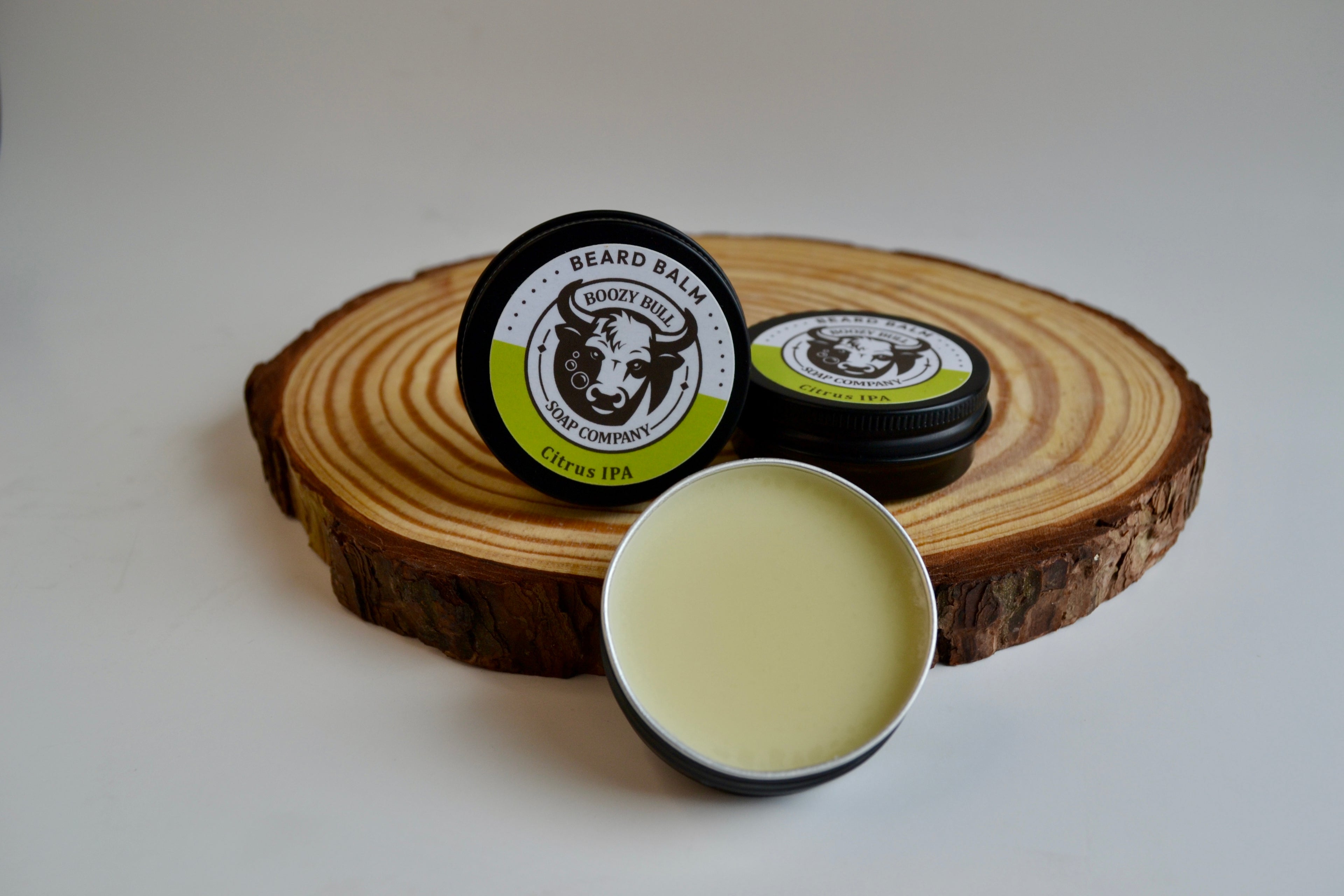 Beard balm with a wooden slice on a white background