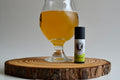 Glass of beer and a bottle on a wooden board with a white background