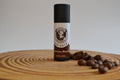 Lip balm with coffee beans on a wooden surface