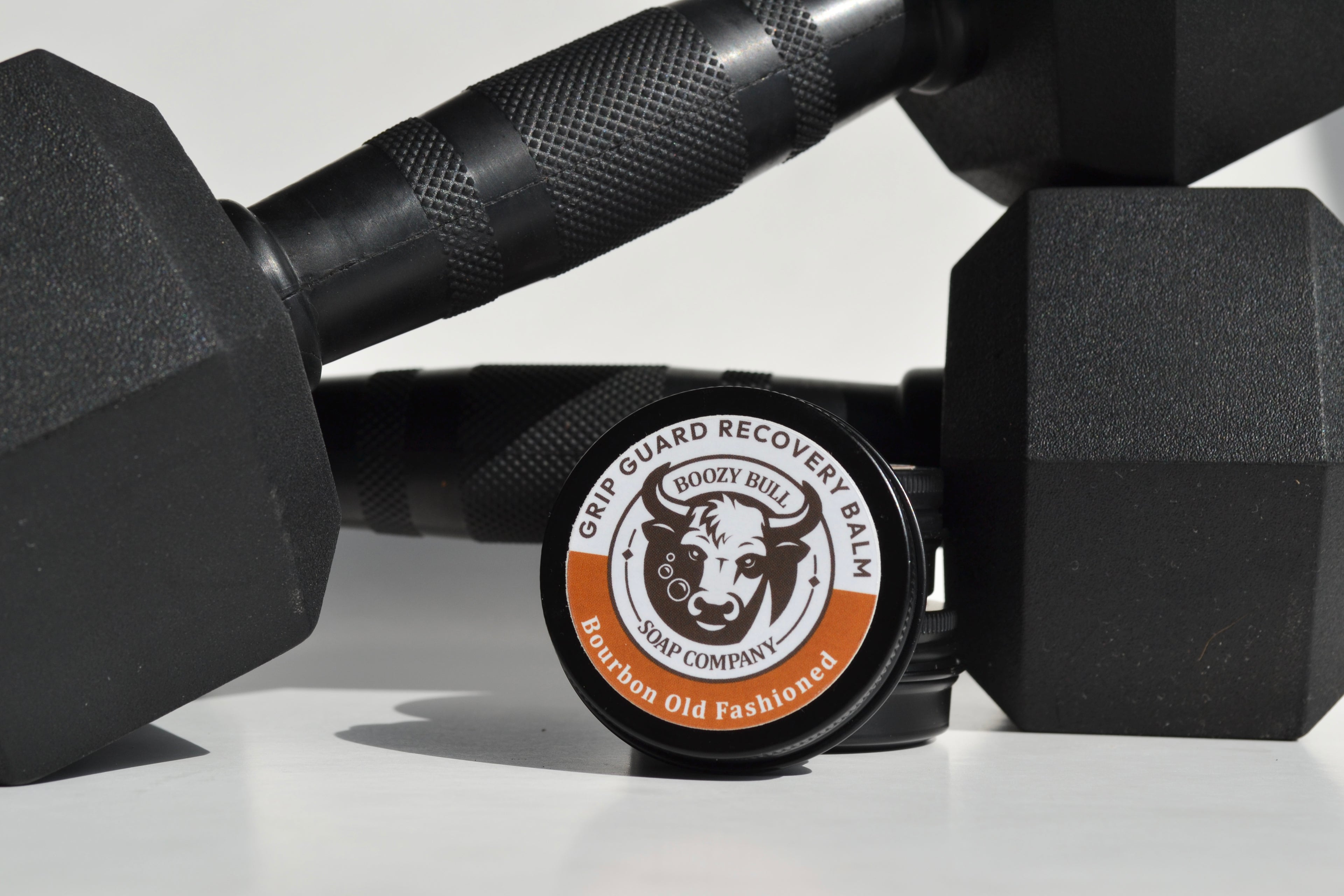 Barber shop balm container with a black dumbbell on a white background