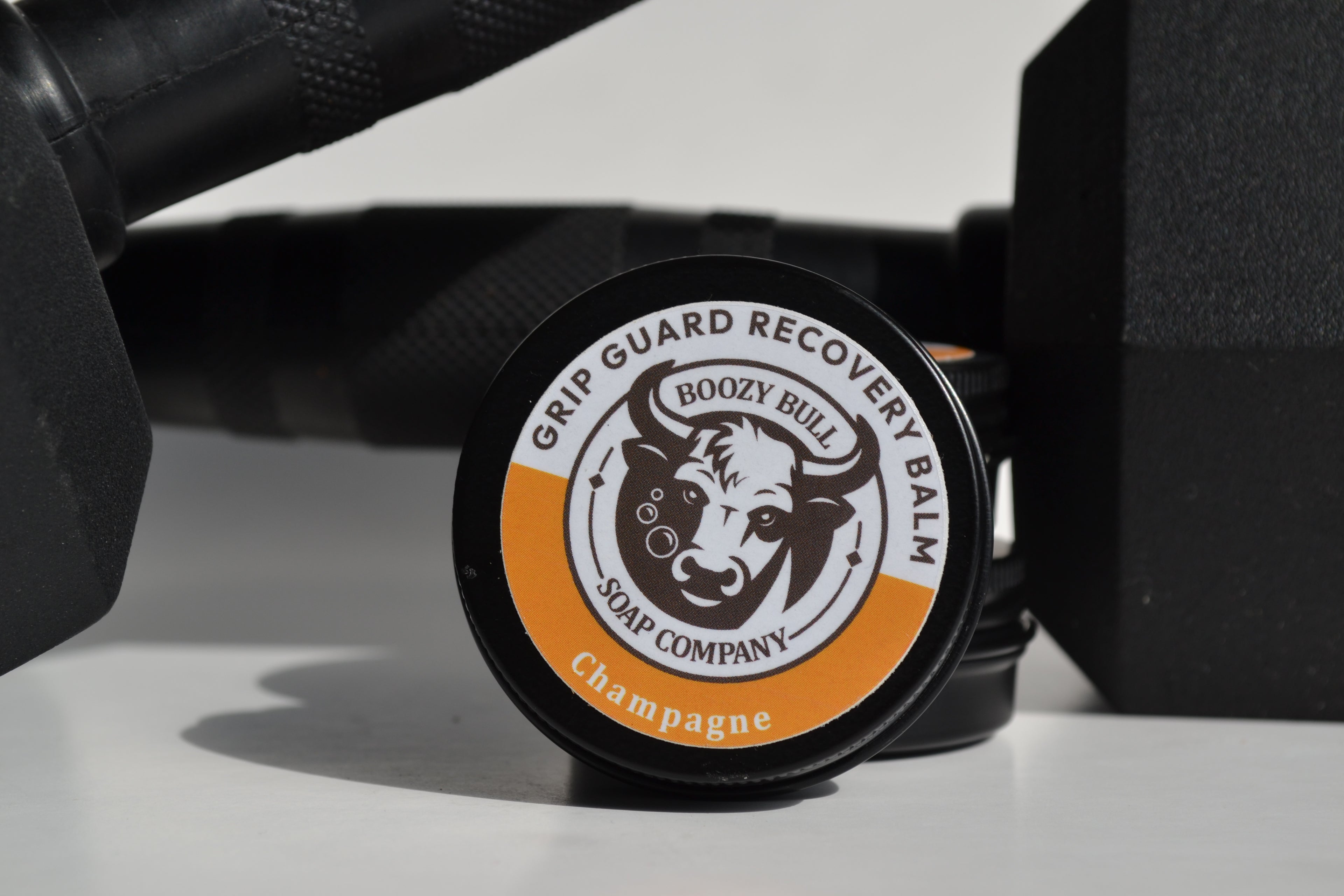 Grip Guard Recovery Balm container with 'Boozy Bull Soap Company' branding on a white surface.