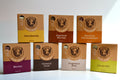 Set of brown cardboard boxes with different flavors on a white background