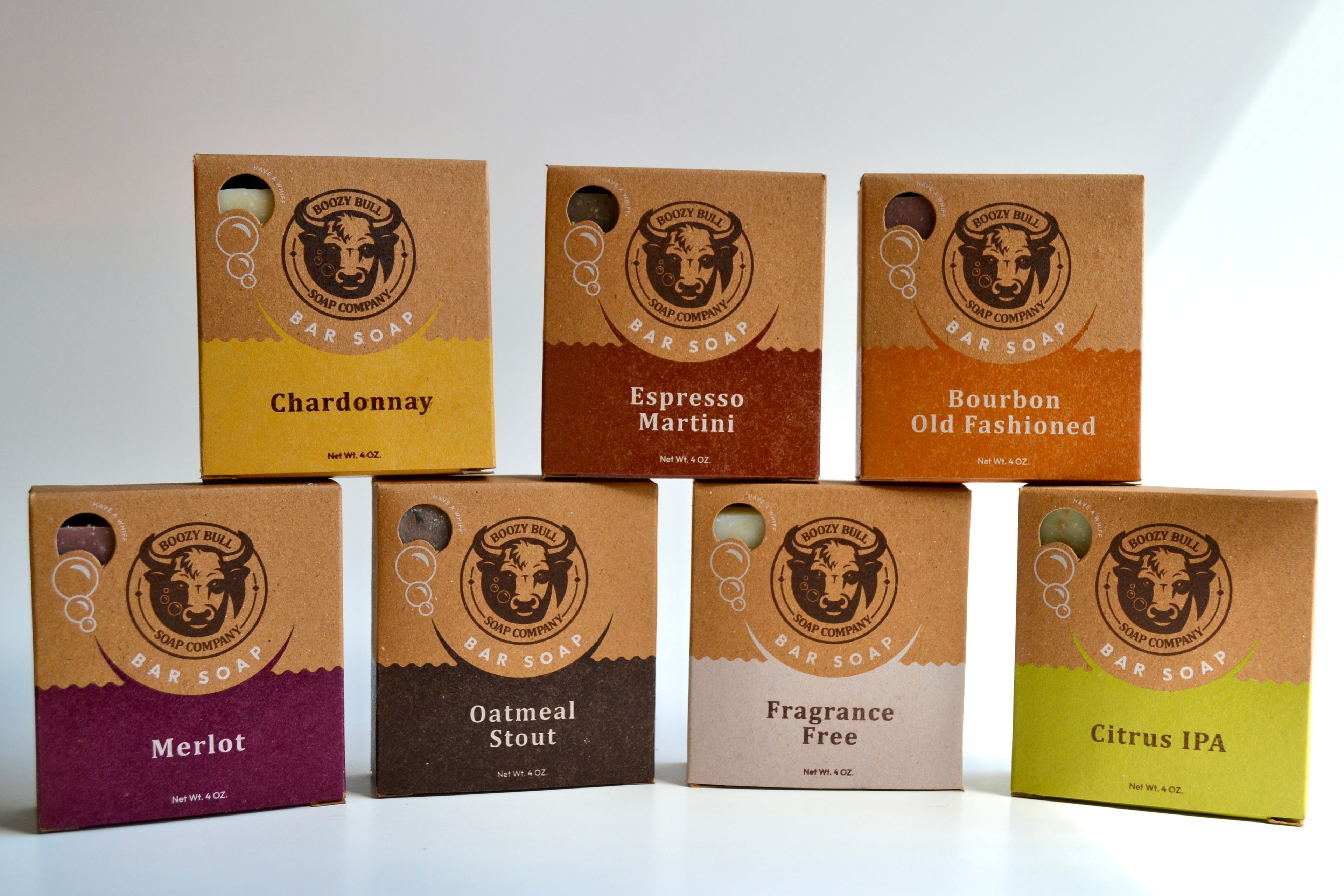 Set of brown cardboard boxes with different flavors on a white background