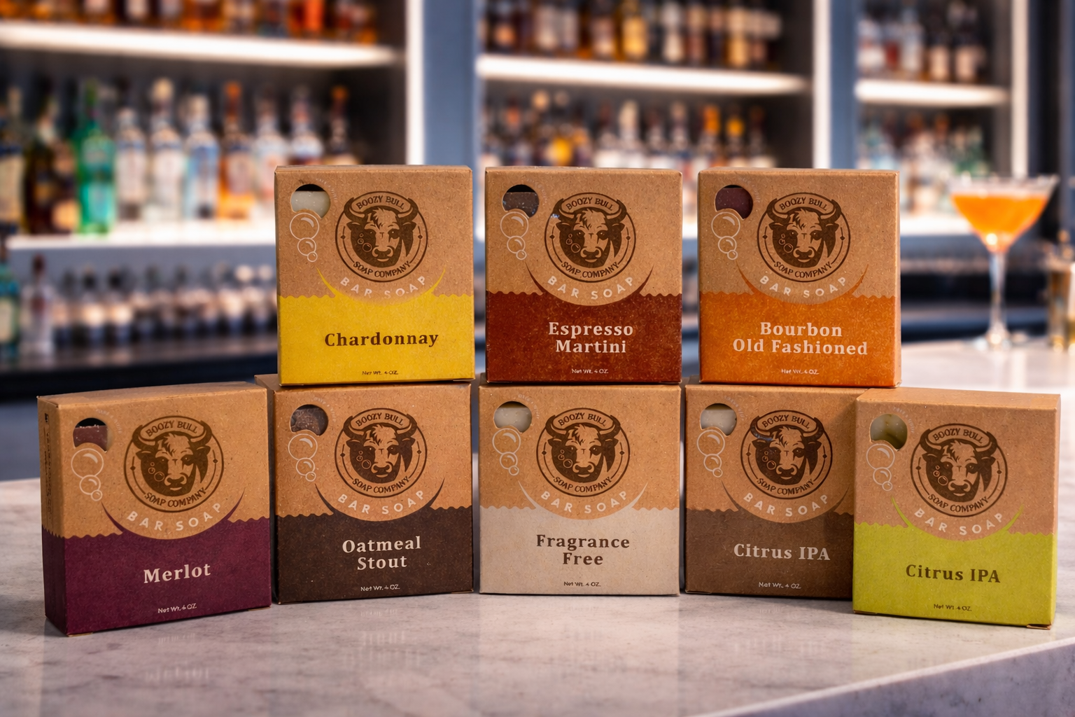 Collection of branded product boxes on a bar counter with a blurred bar background